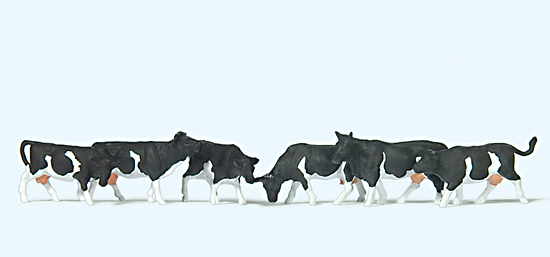6 vaches noires et blanches